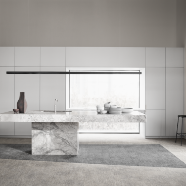 Sleek modern kitchen featuring Ege Carpets' ReForm collection, showcasing sustainable design and elegant marble island with stylish decor.