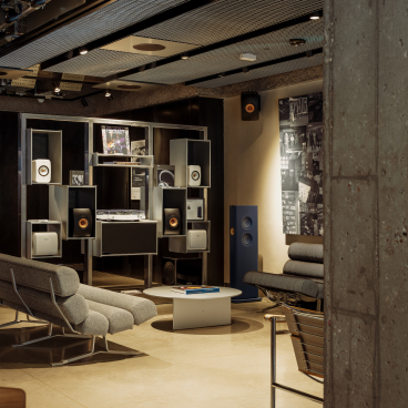 Modern interior of KEF Music Gallery London featuring high-end audio equipment and stylish seating areas.