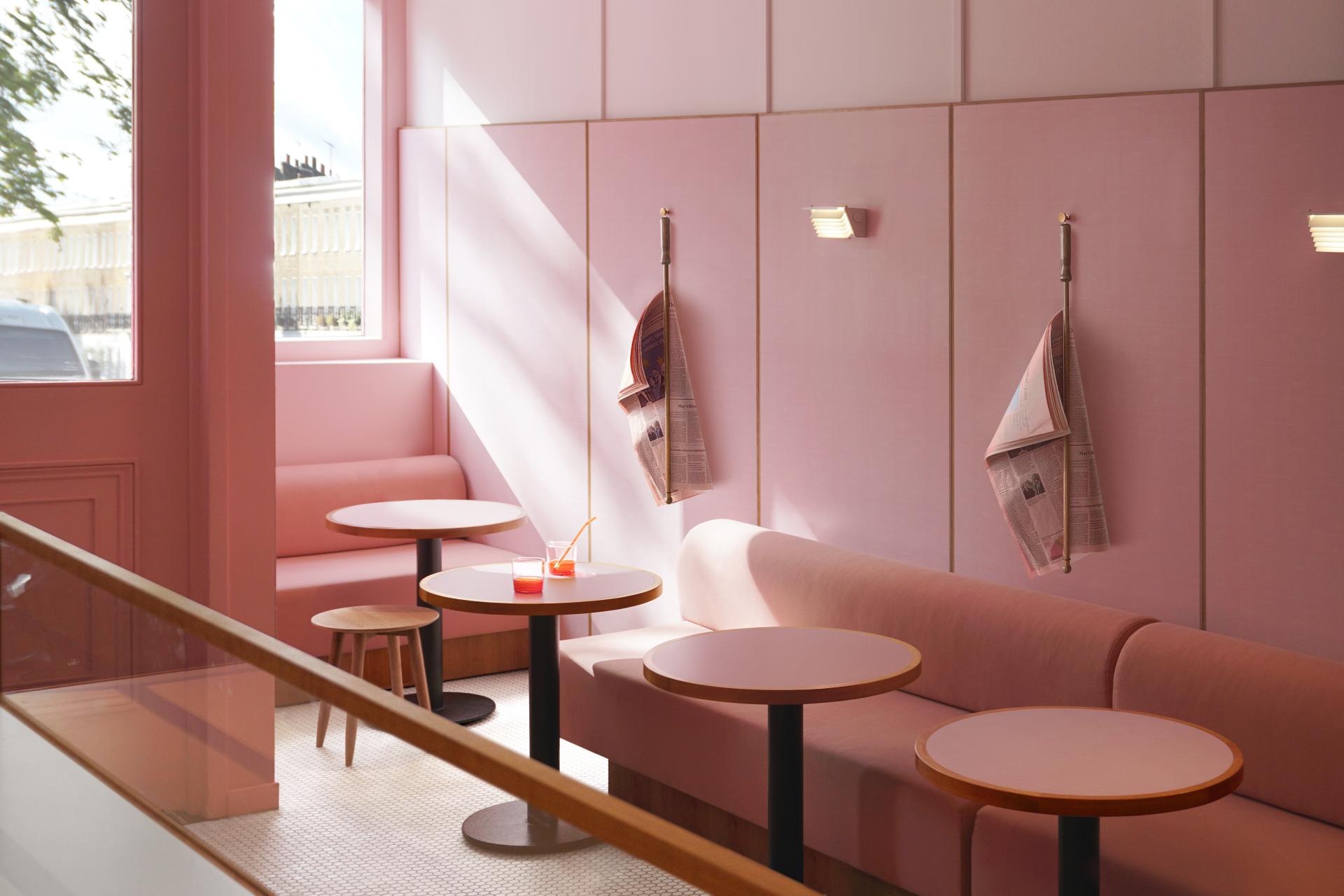 Stylish dusky-pink café interior featuring cozy seating and chic tables, inspired by 1950s design using Formica® laminate.