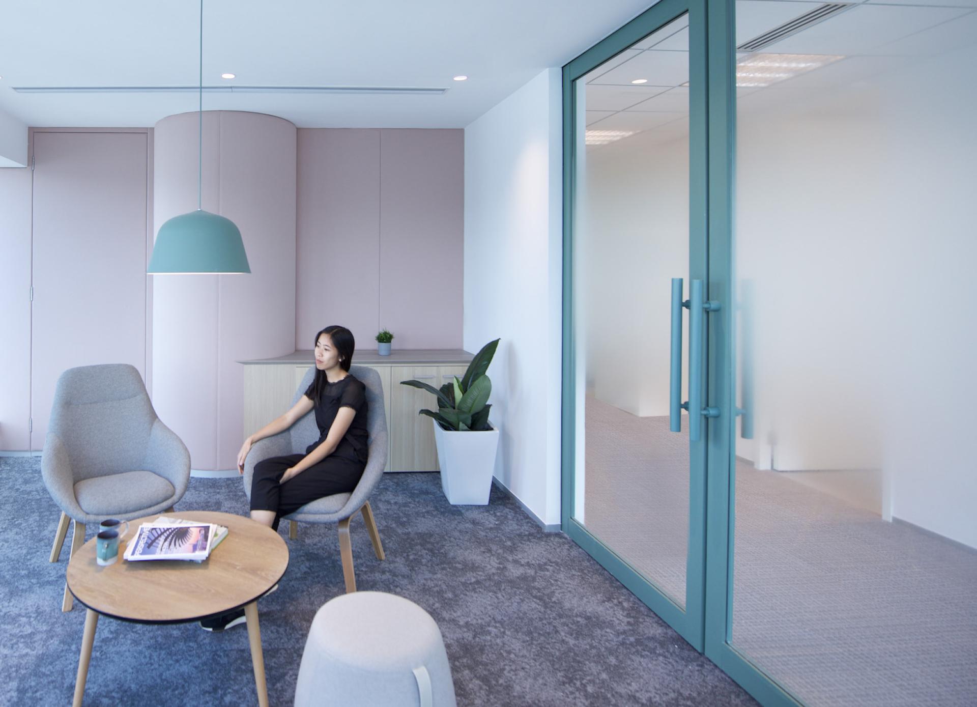 Modern workspace designed by Bean Buro for Jardine Restaurant Group, featuring comfortable seating and contemporary decor.