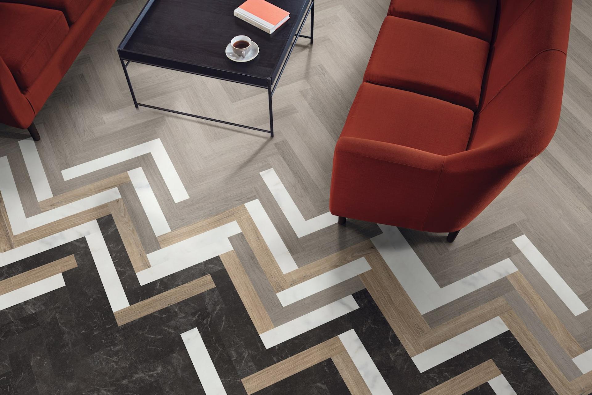Stylish living room featuring Karndean Knight Tile flooring with a contemporary chevron pattern and modern furniture.