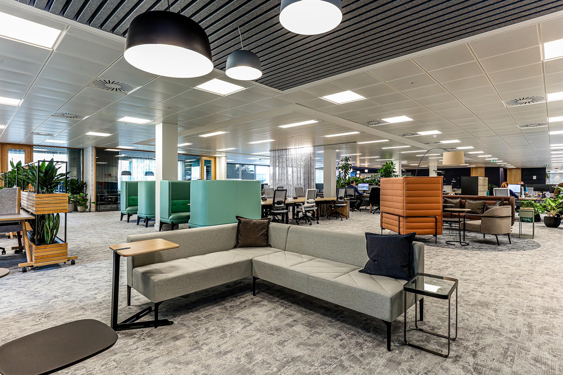 Modern office interior featuring flexible workspaces and inviting seating arrangements at Domestic & General's Wimbledon headquarters.