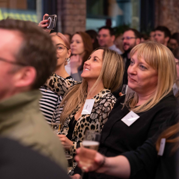Attendees enjoying the Material Source Studio seminar, engaged in conversations and networking at the event.