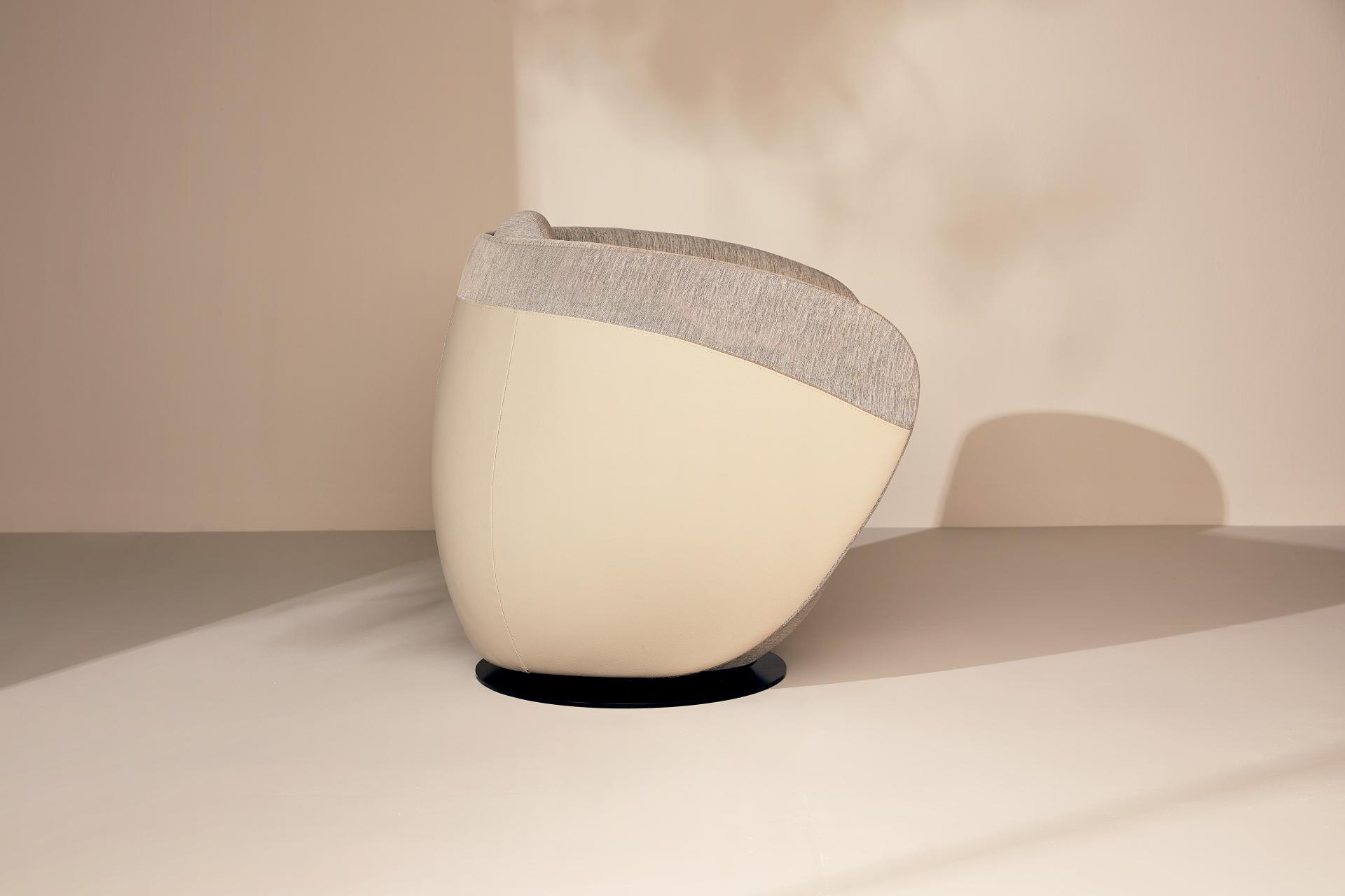 Rounded cocoon chair from Gresham's Relo collection, inspired by sea-smoothed stones for calming workspaces.