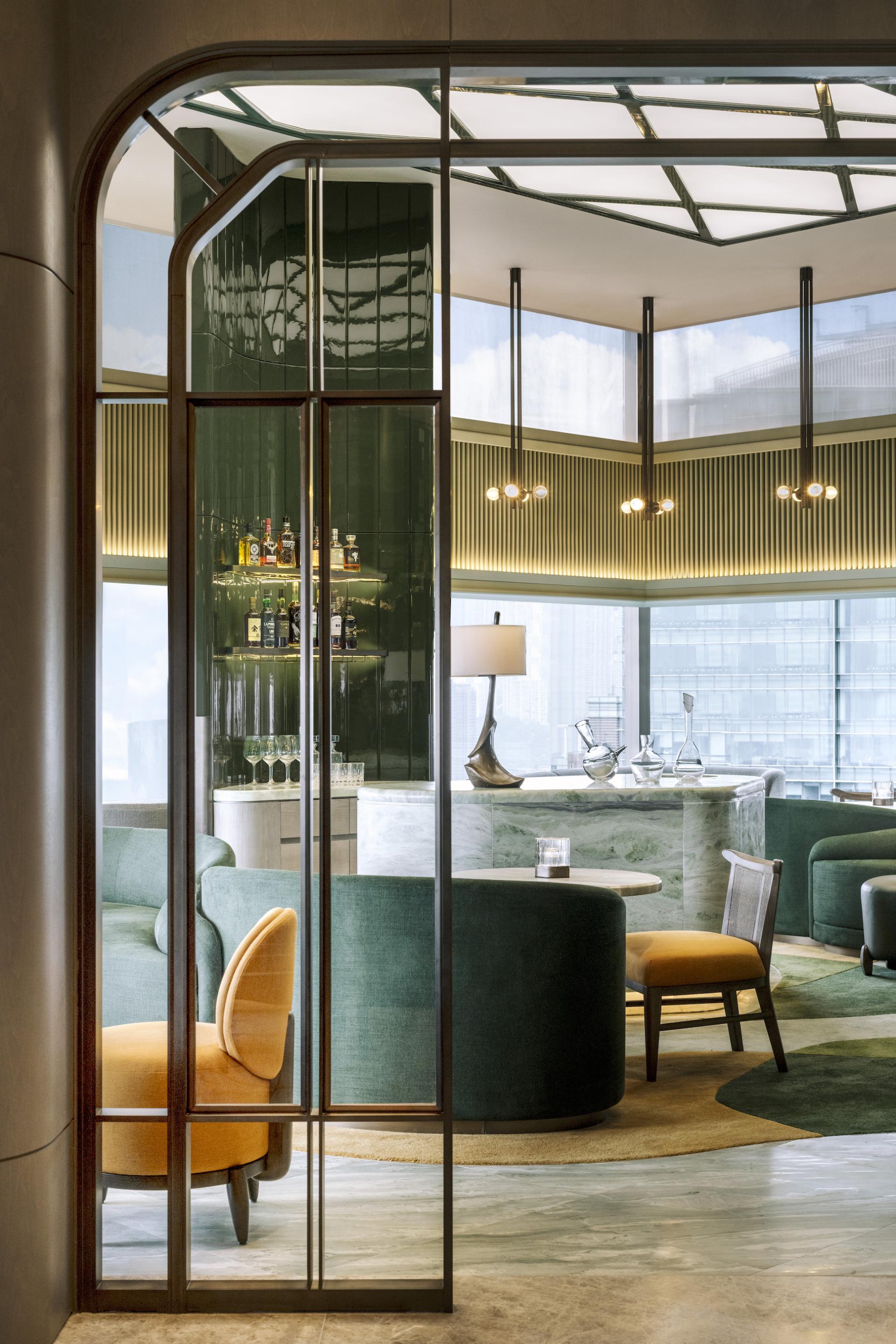 Art Deco interior of The Upper House, featuring elegant seating and a stylish bar with ambient lighting.