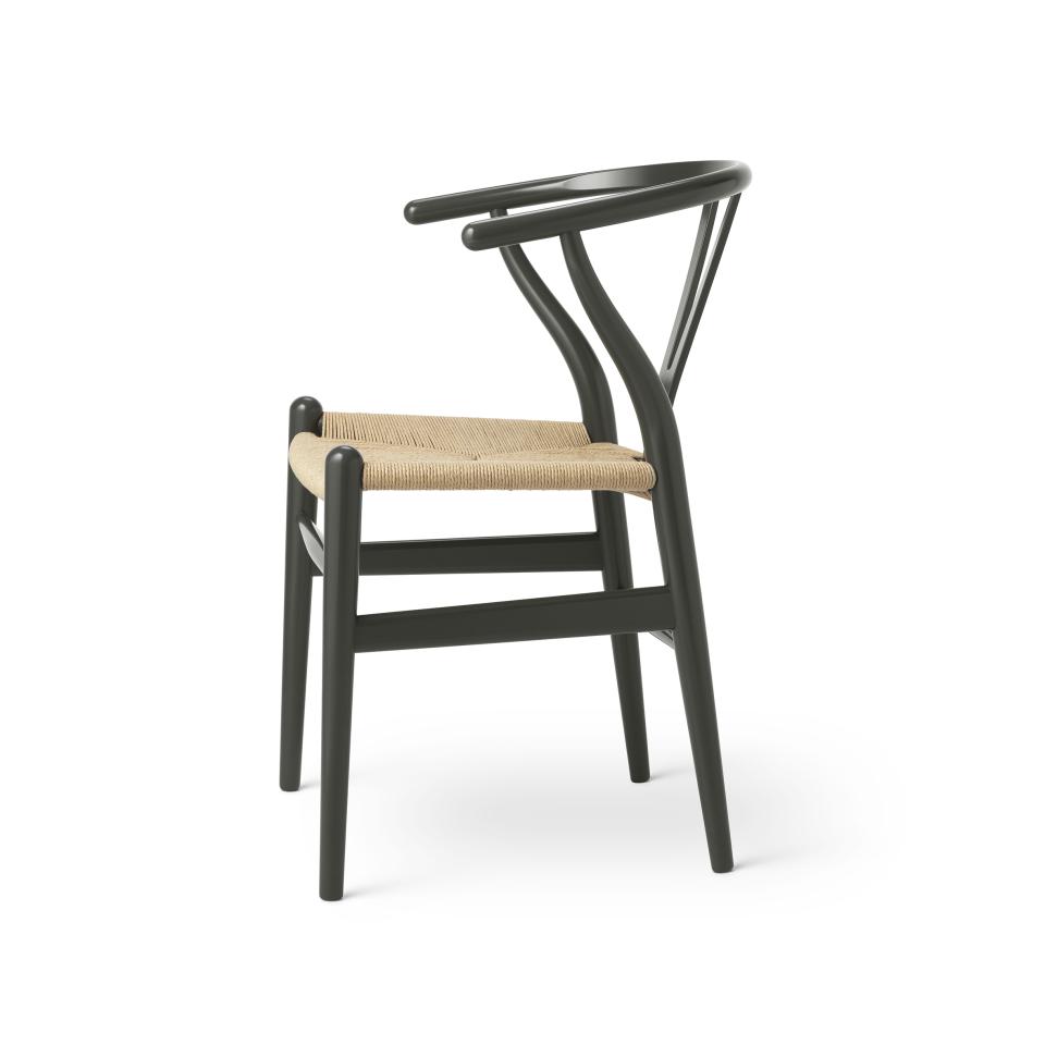 Wishbone chair by Carl Hansen & Son in nature-inspired color, featuring a woven seat and elegant curved design.