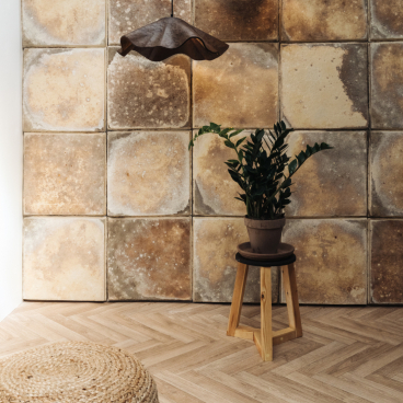 Stylish interior design featuring sustainable decor, including pendant lights, a potted plant, and eco-friendly materials.