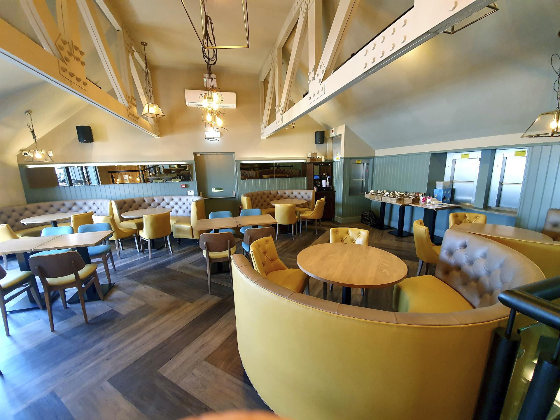 Modern restaurant interior featuring flexible seating arrangements and stylish decor, reflecting adaptability in the hospitality industry.