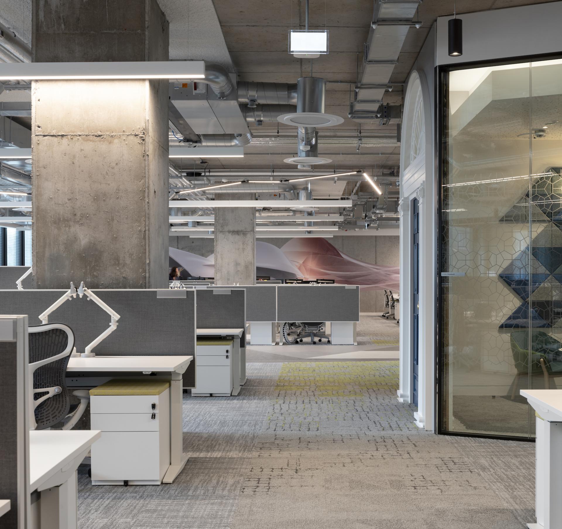 Modern office interior at Autodesk headquarters in Dublin, featuring collaborative workspaces and Martinelli Luce lighting solutions.