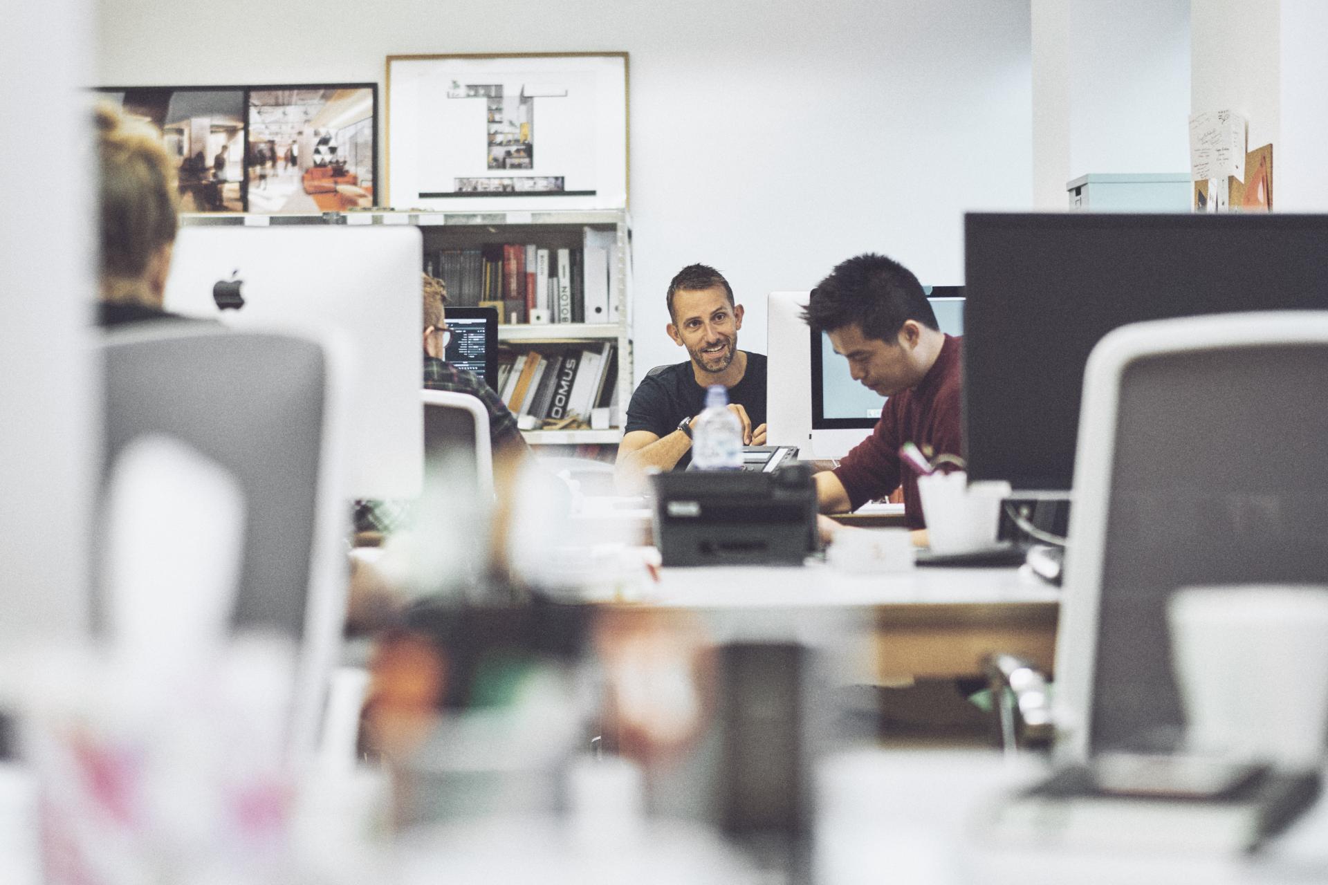 David Holt engages in a team discussion at 74, an interior design and architecture studio in Manchester.
