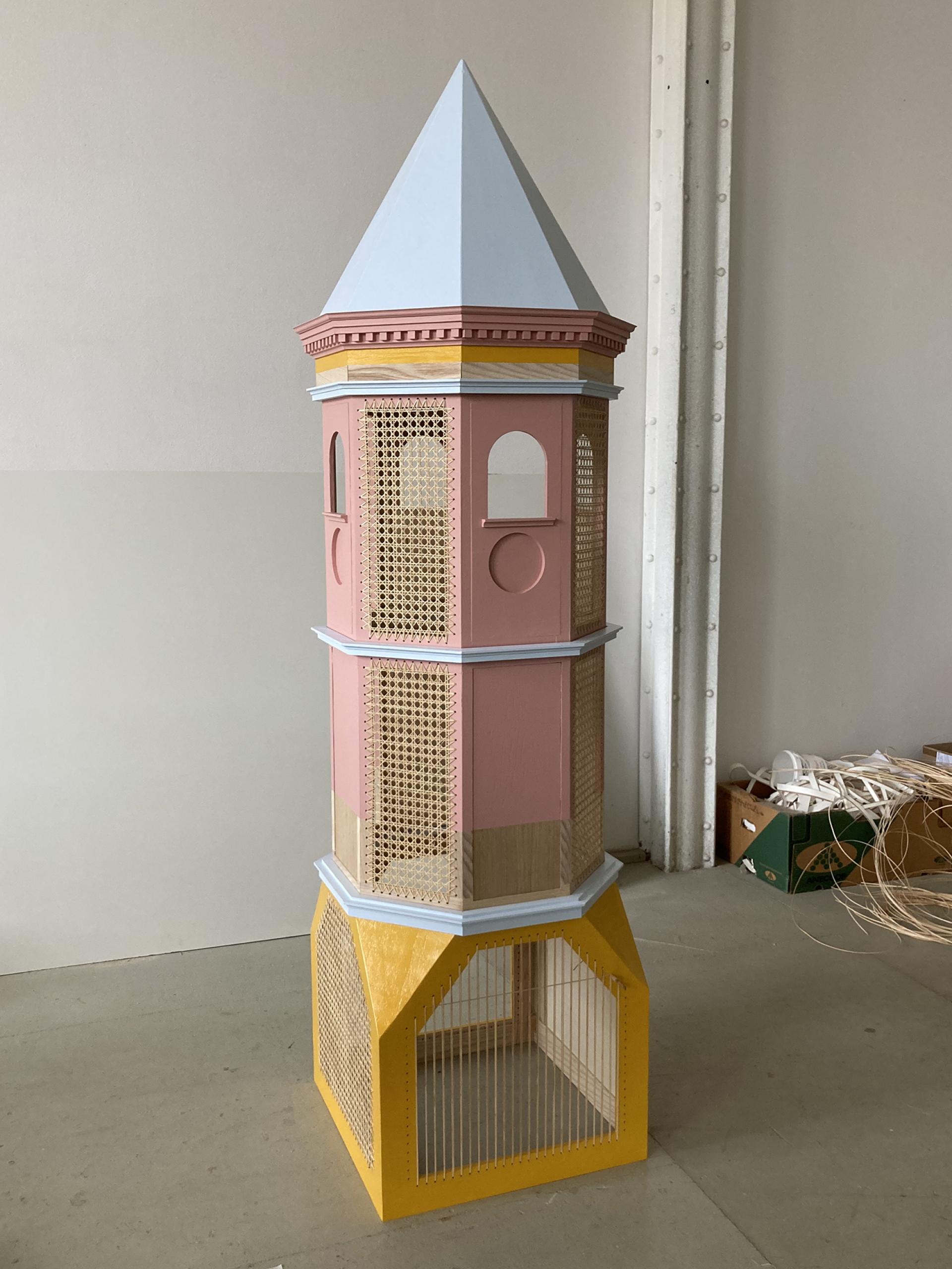 Miniature model of a colorful architectural structure designed by storyteller and model maker Charles Young.