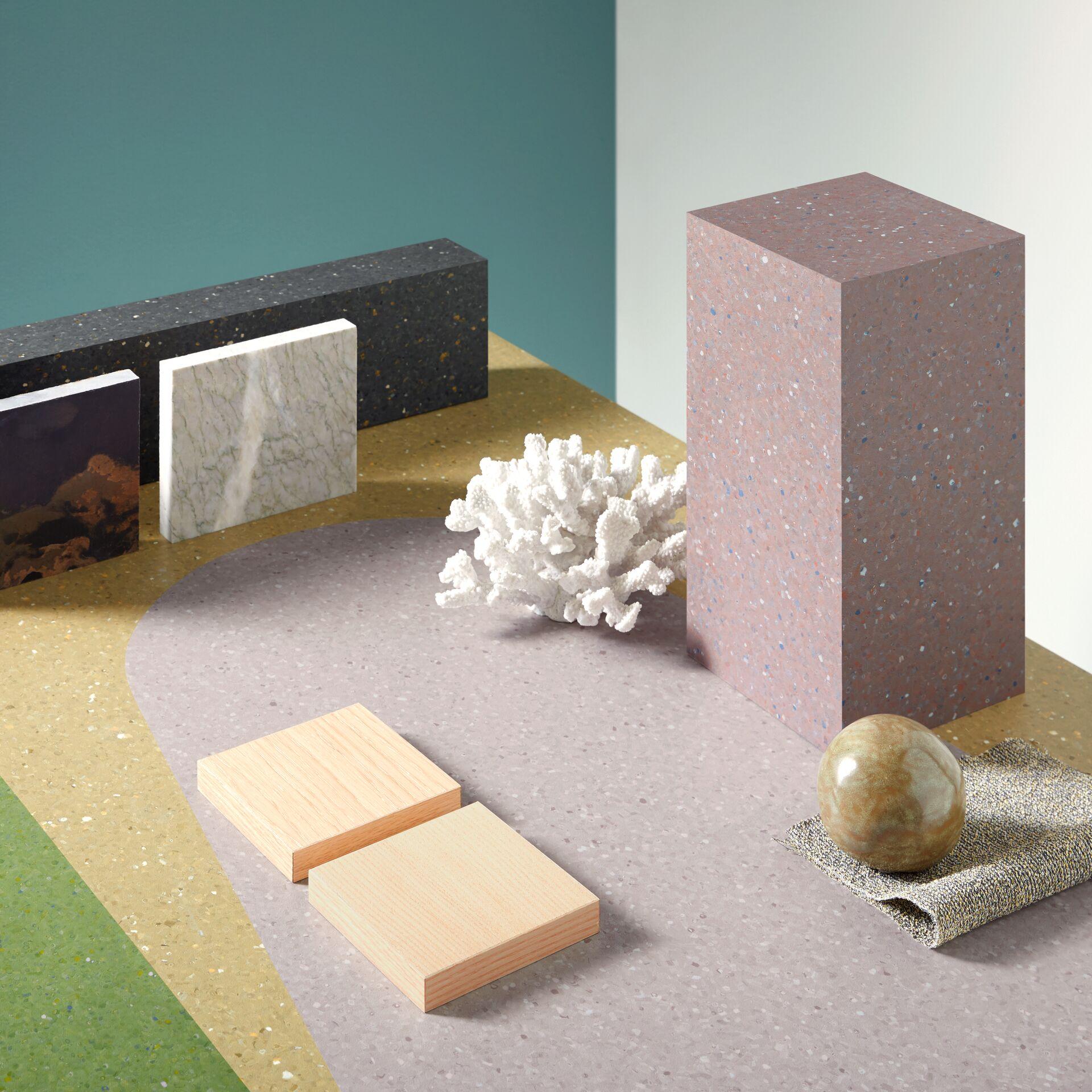Abstract display of various textured flooring materials, including vinyl and stone, emphasizing design for healthcare environments.
