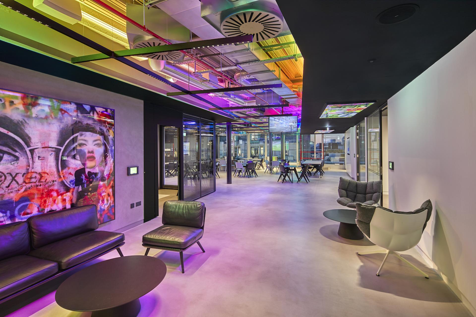 Innovative office interior design at Sports Direct's new London location, featuring vibrant colors and modern furnishings by PENSON.