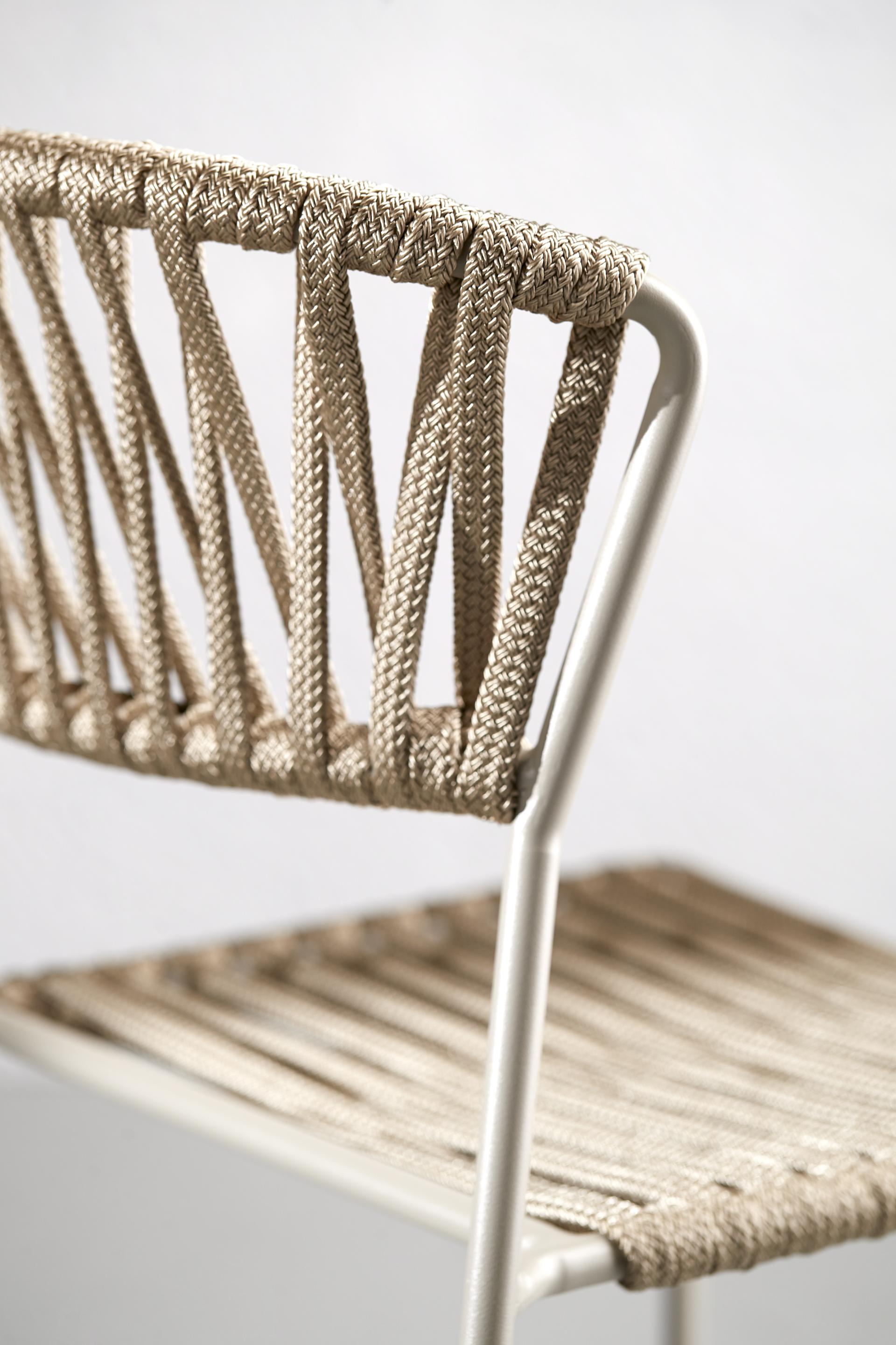 Stylish Lisa chair featuring a woven rope backrest and seat design by SCAB Design, acclaimed for its Red Dot Award 2020.
