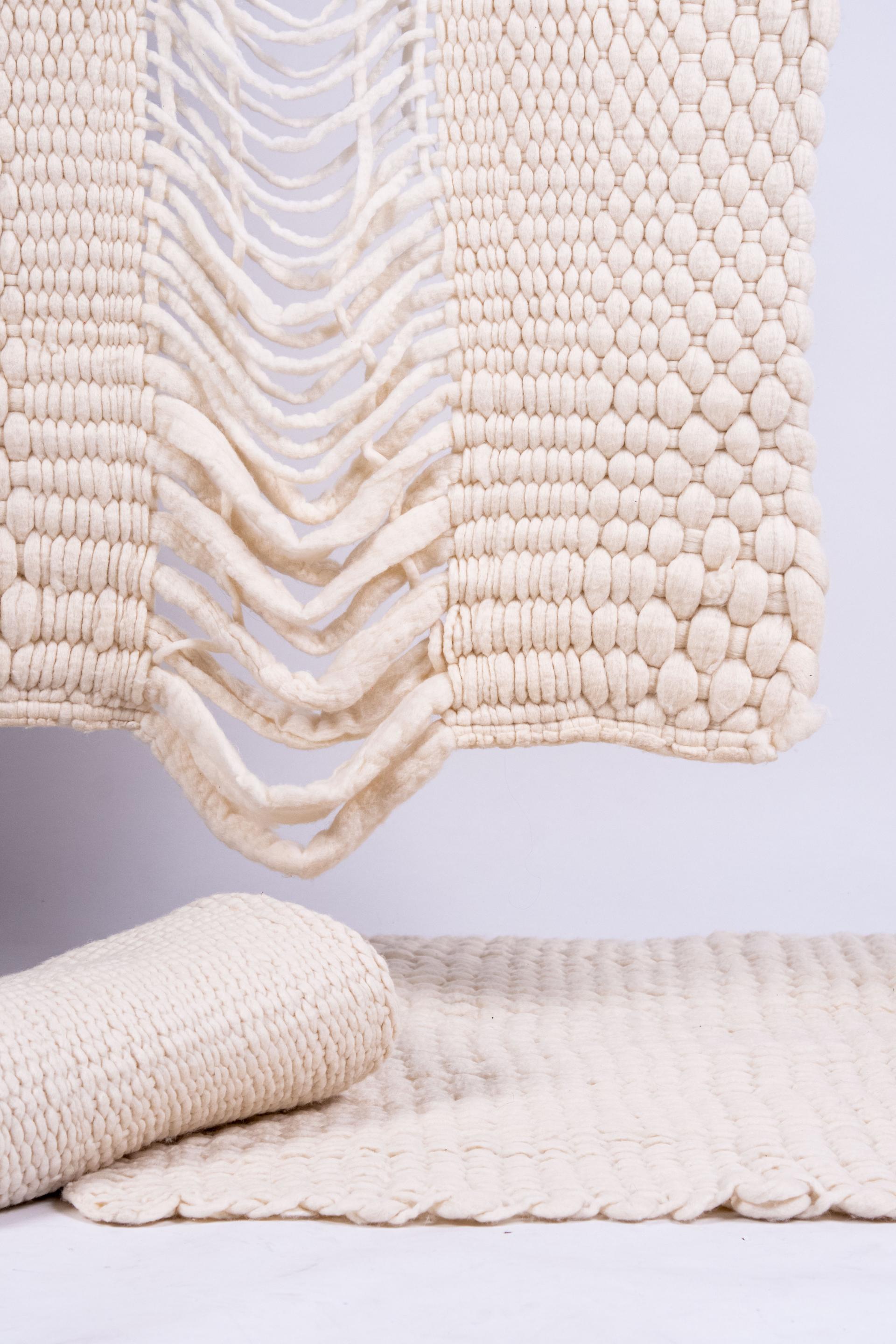 Sustainable textile innovation displayed at Munich Fabric Start featuring elegant, eco-friendly woven fabrics in neutral tones.