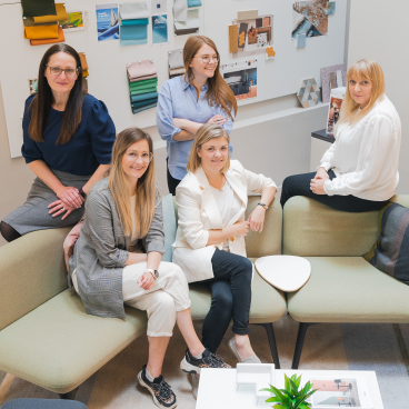 M1NT Studio's team collaborates in a contemporary workspace, showcasing innovative interior design and architectural concepts.
