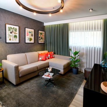 Vegan hotel suite designed by Bompas & Parr, featuring plant-based materials, modern decor, and greenery.