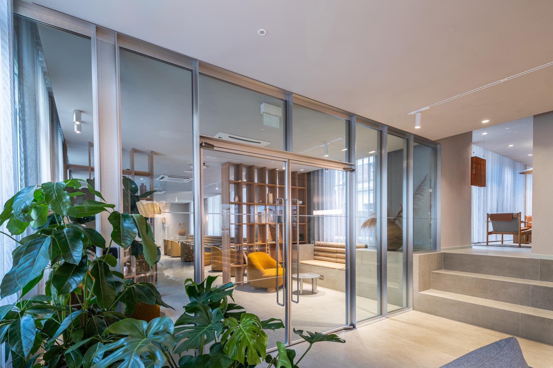 Modern, flexible workspace at Chancery House featuring lush plants and inviting seating areas for enhanced wellbeing.