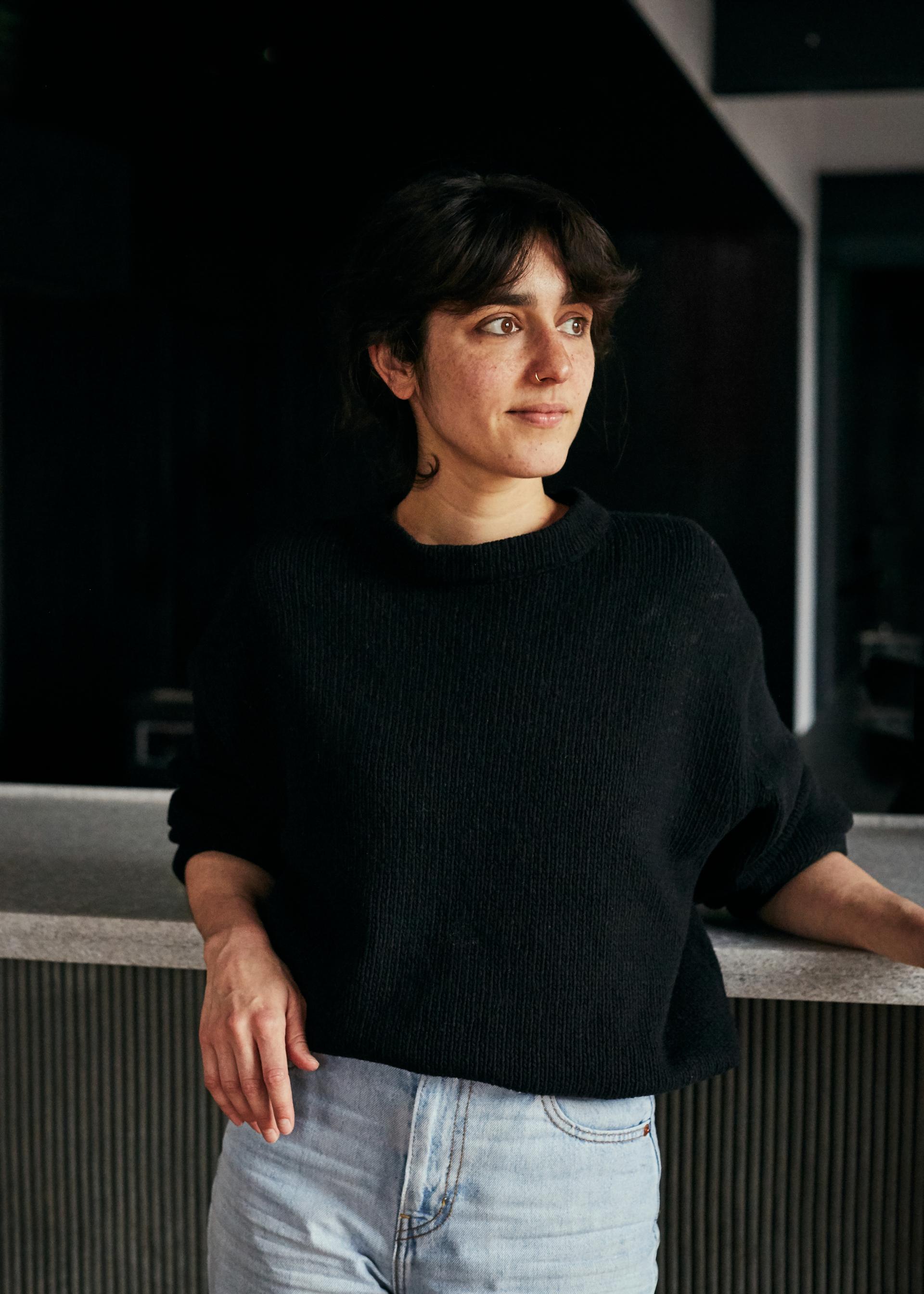 Creative designer standing by a counter in Silo, the innovative zero-waste restaurant by Douglas McMaster.