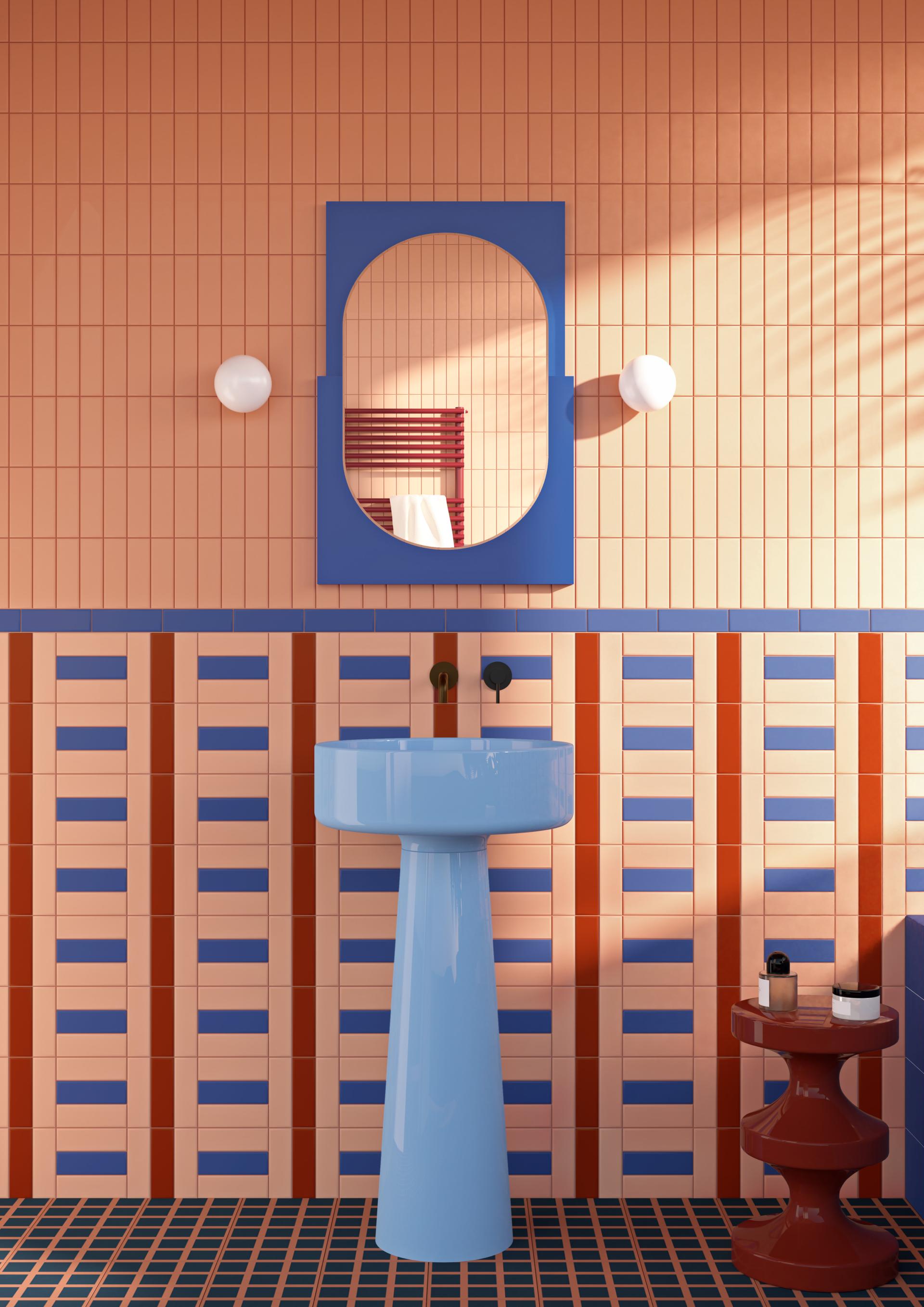 Vibrant bathroom featuring bold tile combinations, a blue sink, and a colorful wall mirror, showcasing the Färgblock collection.