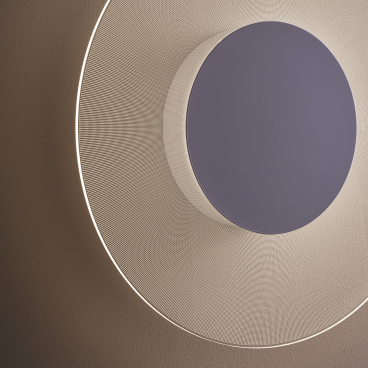 Modern circular wall light by Astro Lighting with textured design and warm ambient glow, showcasing contemporary lighting innovation.