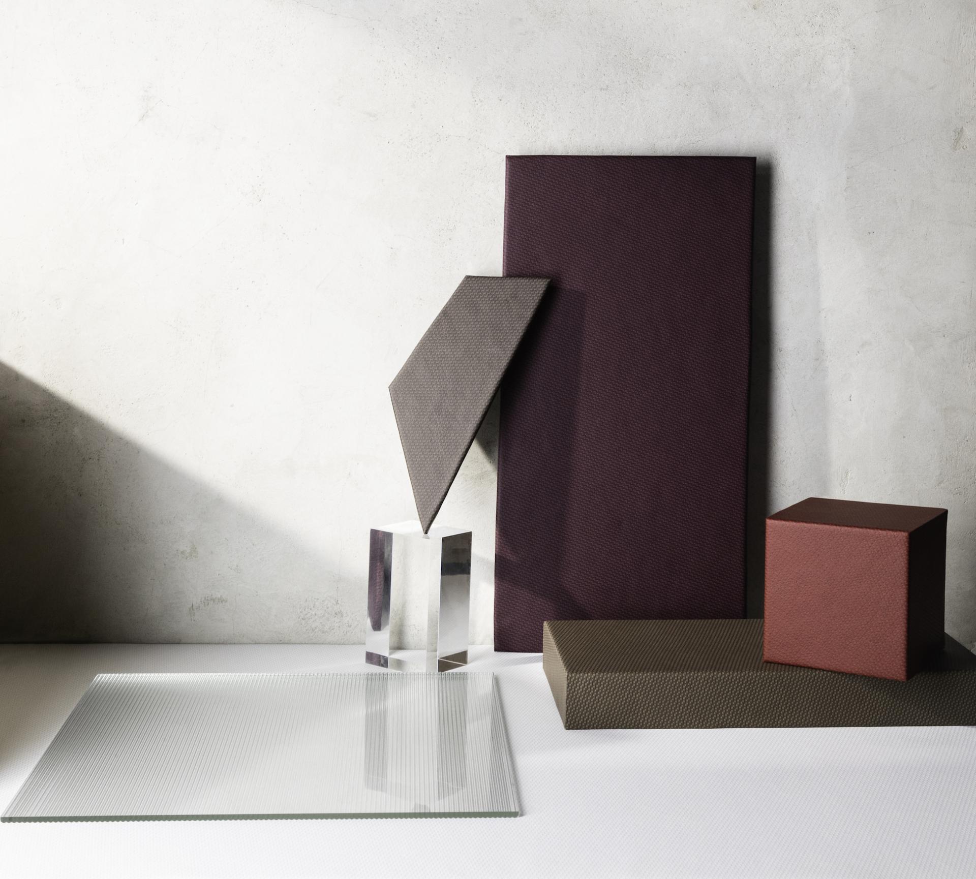 Textured performance textiles from Ultrafabrics' Spectra collection displayed on a table against a minimalist backdrop.