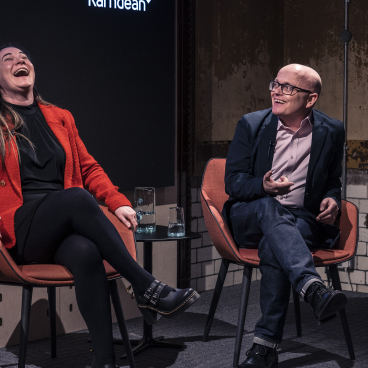 Panel discussion during the Material Source Studio seminar on sustainability, featuring engaging conversations and laughter among participants.