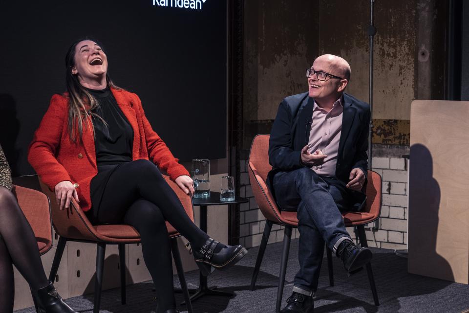 Panel discussion during the Material Source Studio seminar on sustainability, featuring engaging conversations and laughter among participants.