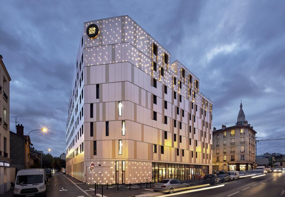 JO&JOE Paris Gentilly exterior showcasing modern architecture and starry lighting, recognized as Best Hotel & Tourism Resort 2020.