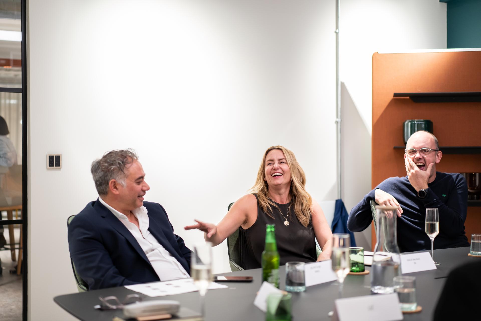 Participants engage in a lively discussion at a conference on the future of education, showcasing collaboration and innovation.