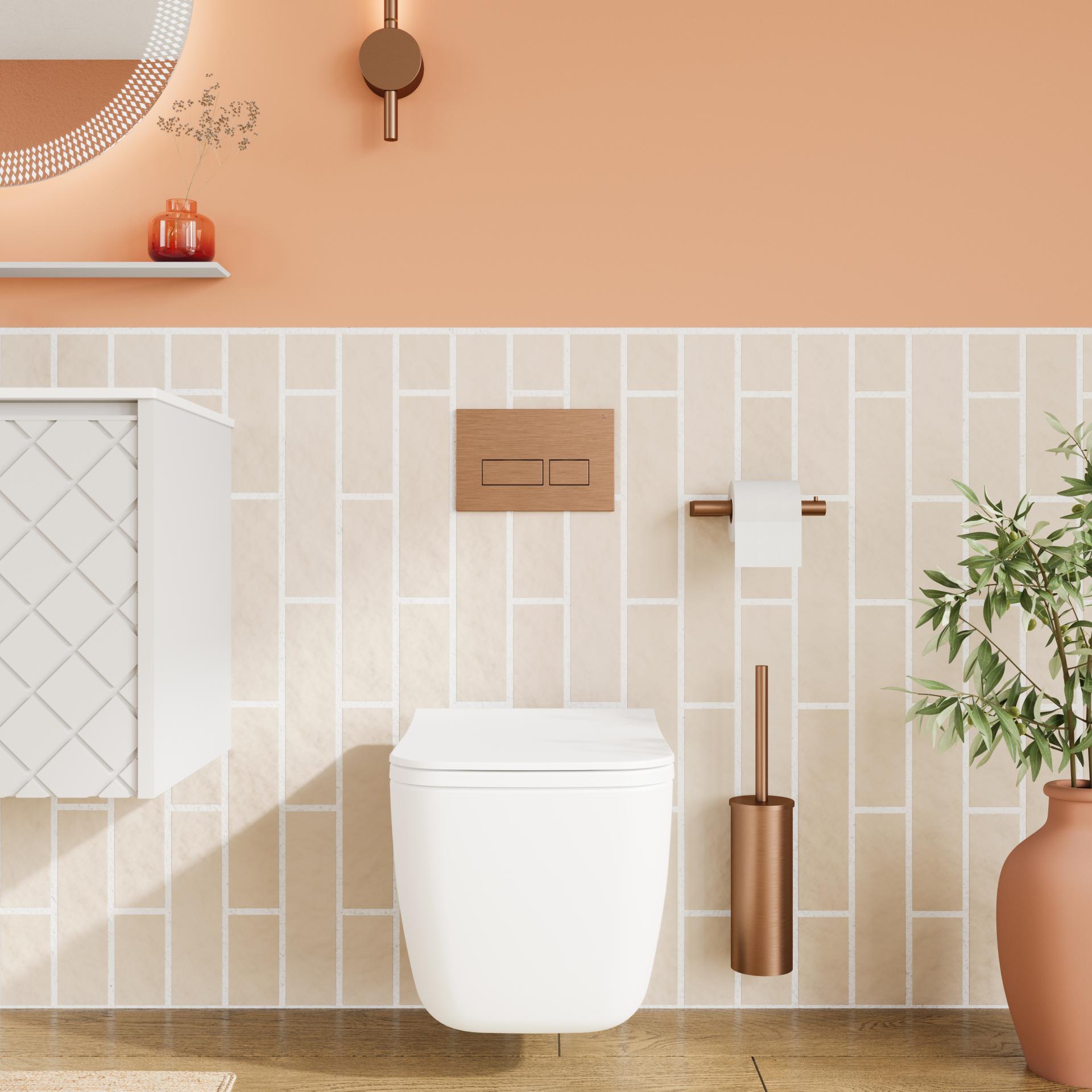 Modern bathroom design featuring a white toilet, warm peach wall, and stylish fixtures for a bold aesthetic.