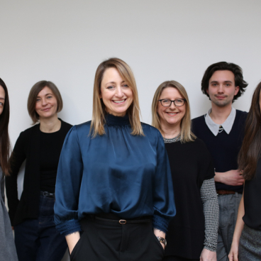 Jo Love with her Love Interiors team, showcasing collaboration and creativity in design-focused environment.