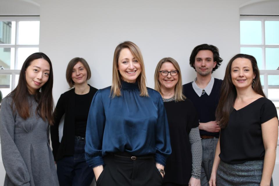 Jo Love with her Love Interiors team, showcasing collaboration and creativity in design-focused environment.