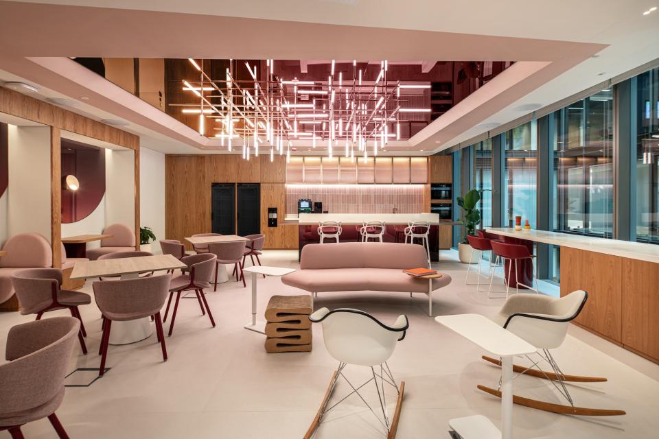 Modern Dubai office space featuring vibrant colors, contemporary furniture, and natural light, creating an inspiring workplace environment.
