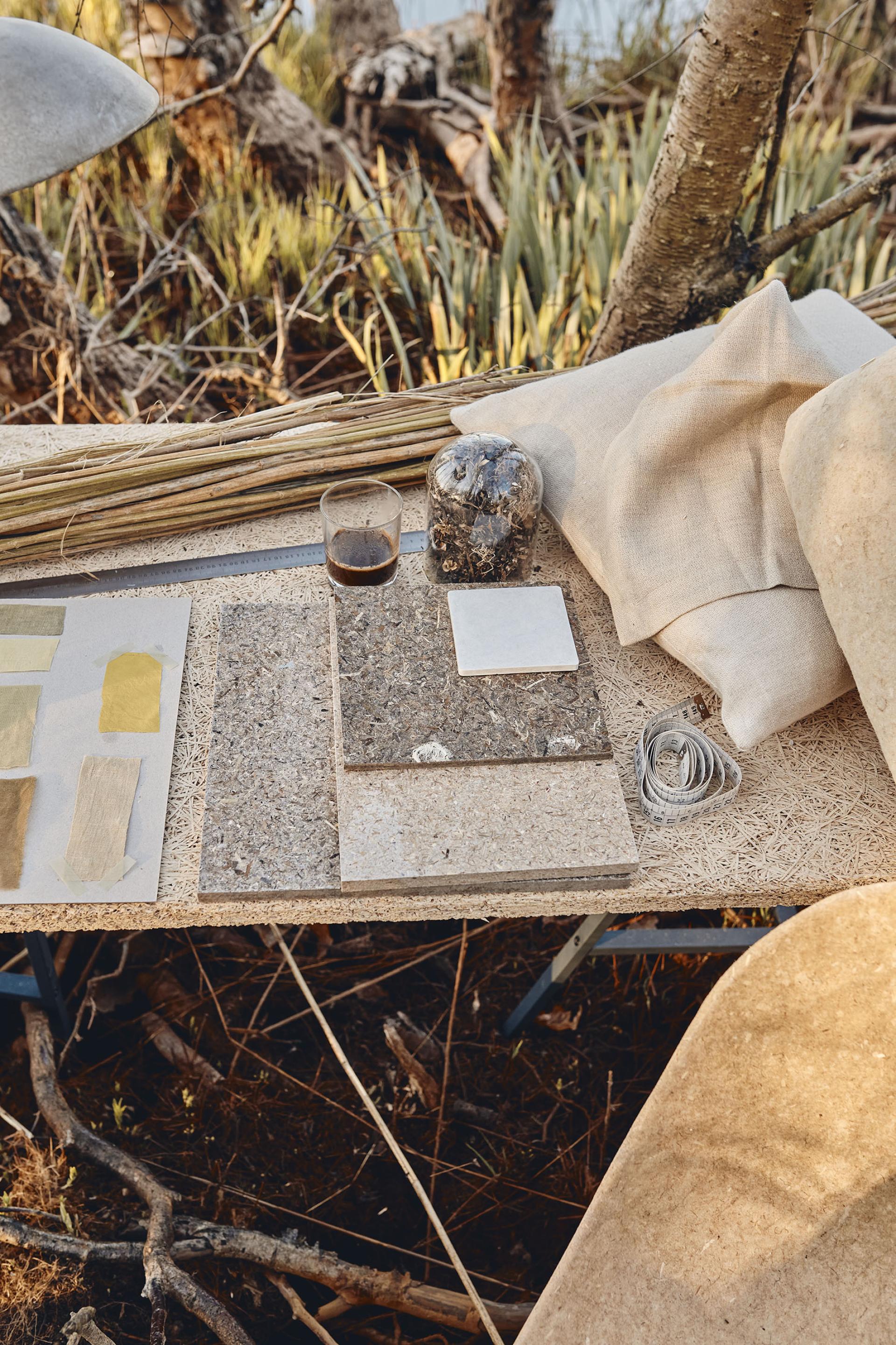 Design materials and textures on a table, showcasing sustainable elements for future interior design trends.