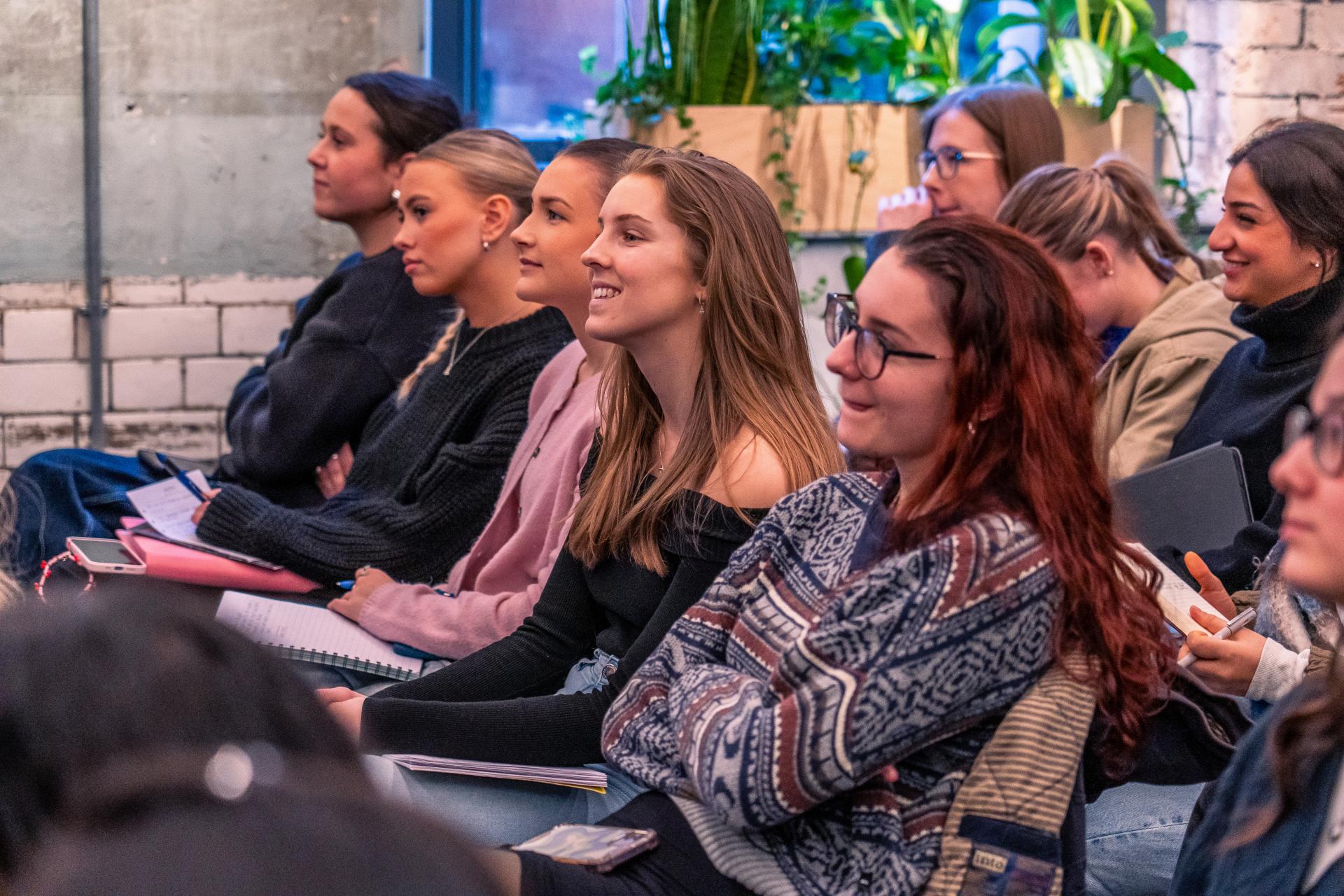 Students engaged in a lecture during MMU's Green Week, discussing sustainable interior design practices for the future.