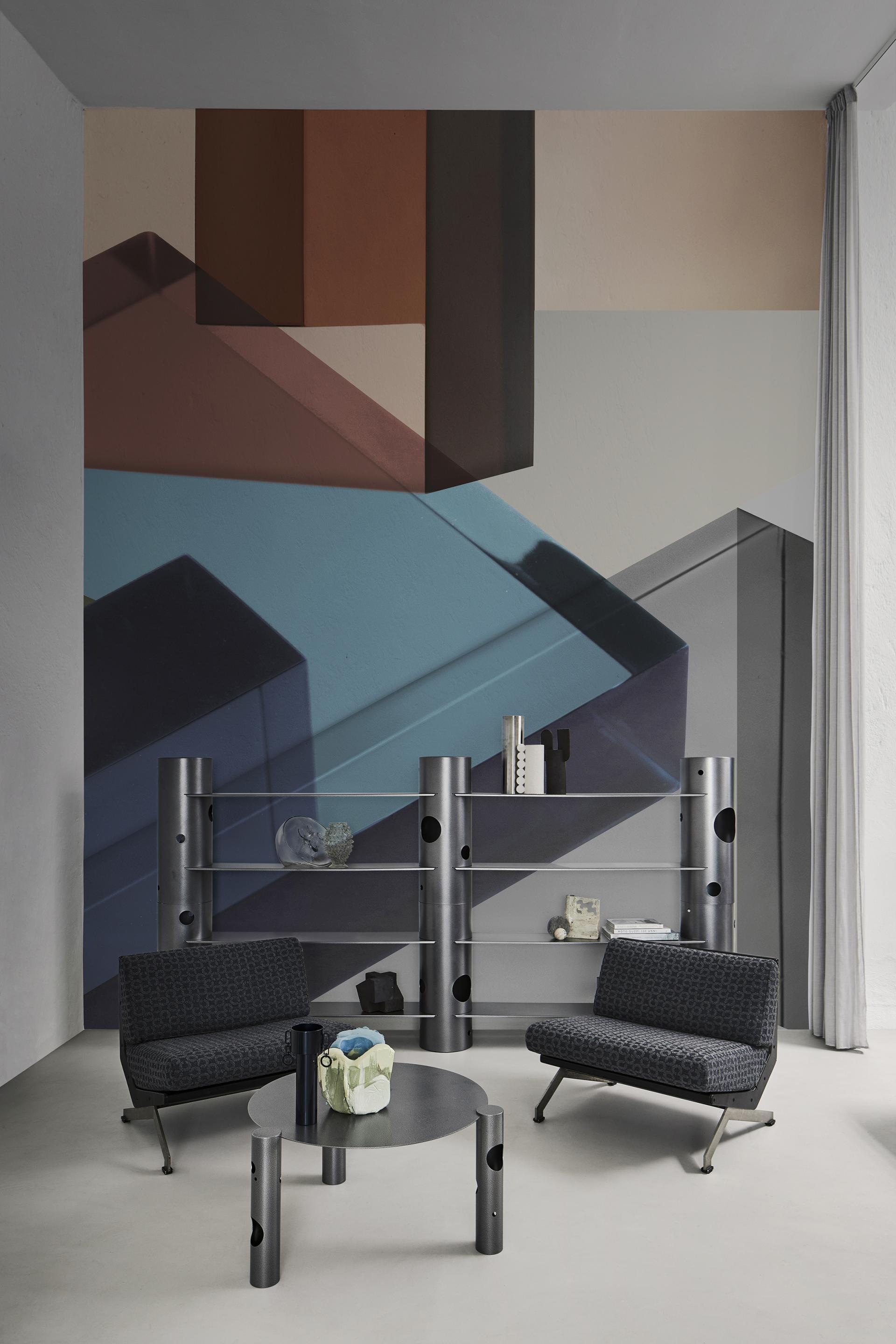 Contemporary interior featuring Wall&decò's bold geometric wallpaper design, stylish furniture, and modern decor elements.