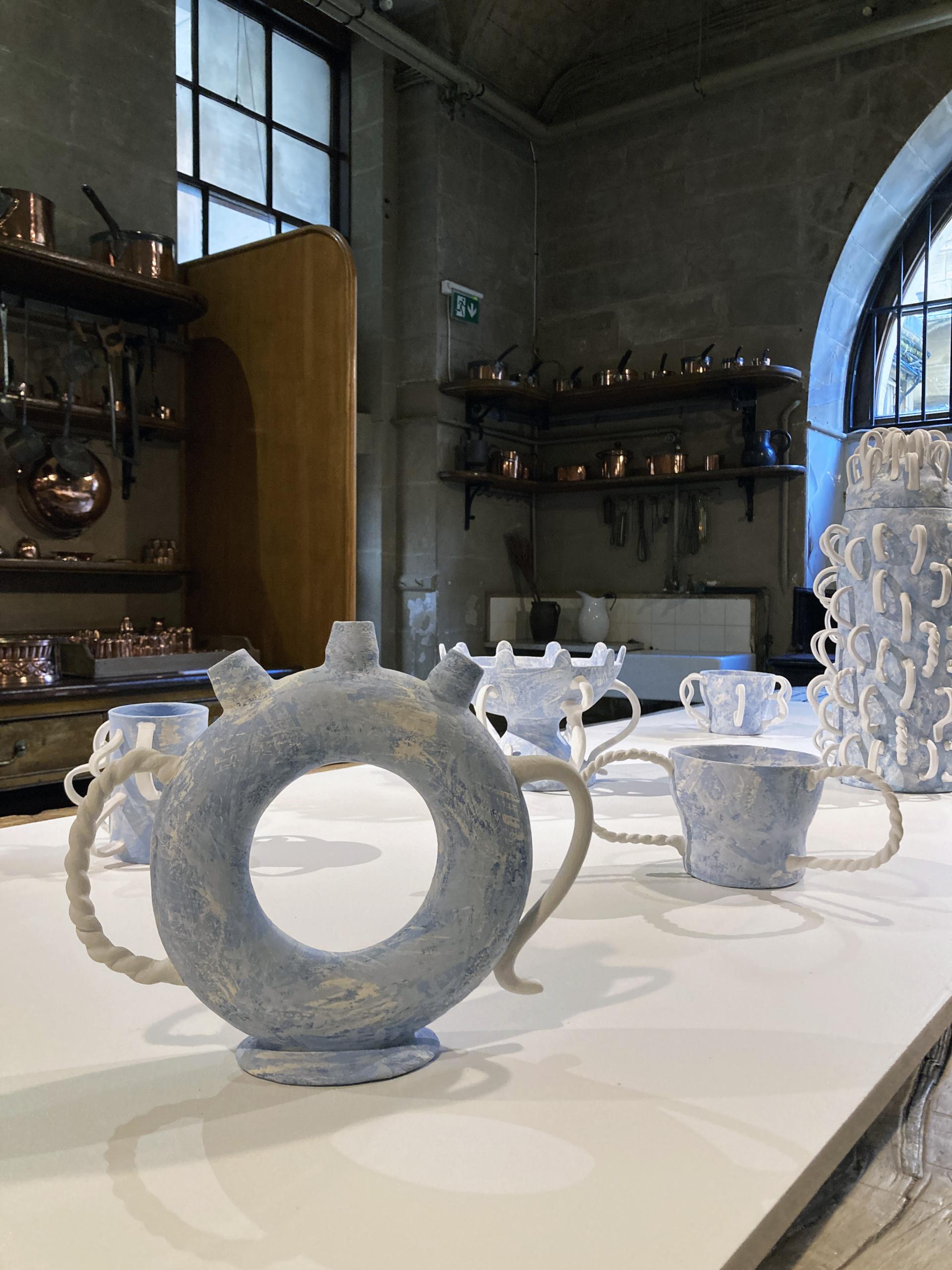 Ceramic vessels by Jo Woffinden displayed at Harewood House Biennial, showcasing unique craft techniques and artistic design.