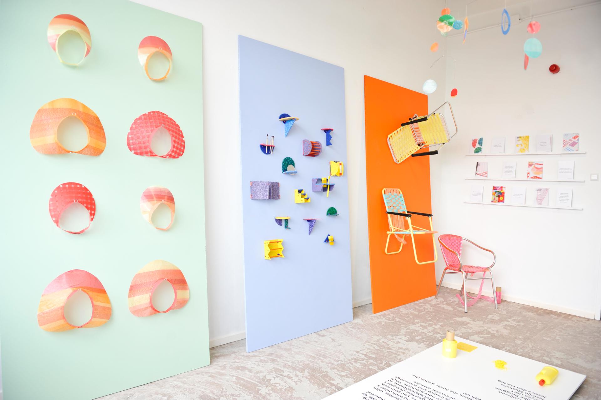 Colorful wall art made from recycled plastic by designer Jessica den Hartog, showcasing innovative designs and collaborative creativity.