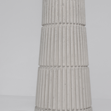 Stylish concrete planter from Tiipoi's Siment collection, showcasing modern architectural design with textured vertical lines.