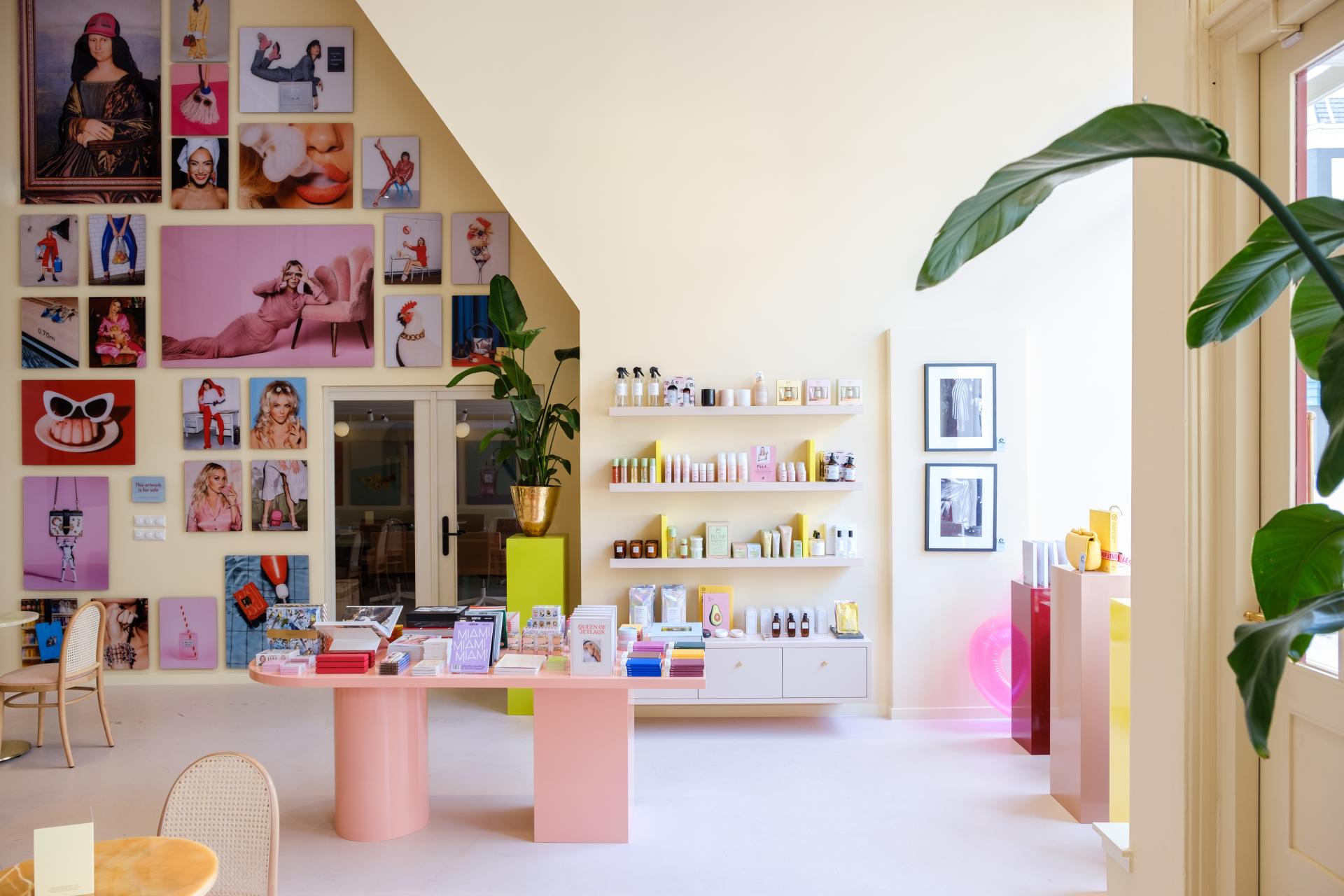 Bright, playful office space featuring a colorful Onyx bar, fixtures, and vibrant art displays for Dutch media brand &C.