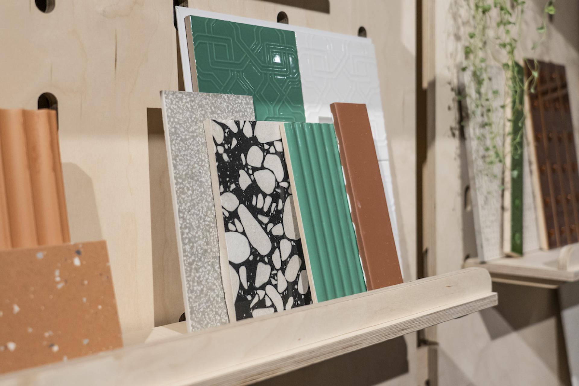 Diverse selection of textured tiles and materials showcased at Material Source Studio in Glasgow for design inspiration.