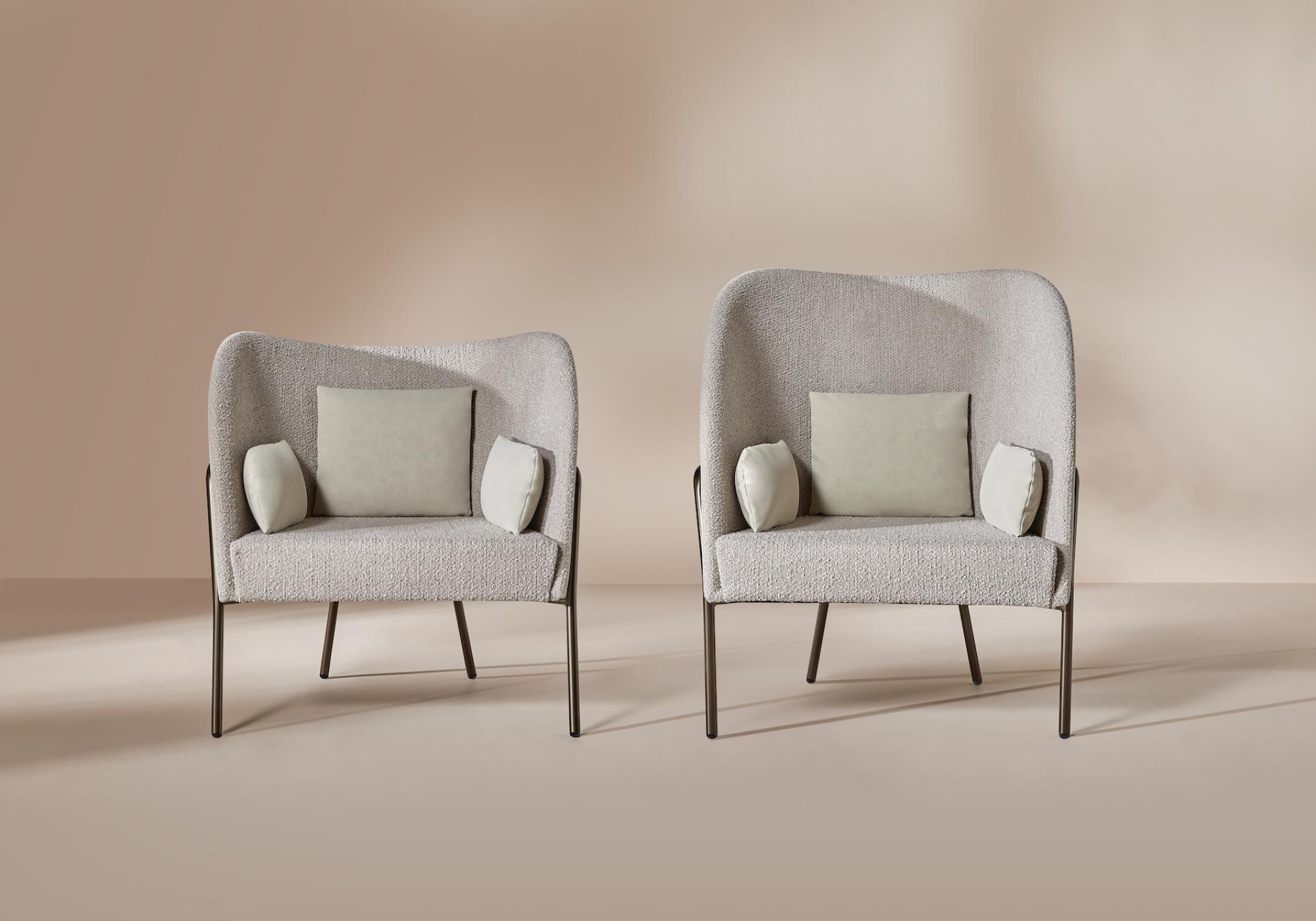 Two modern, plush Tiros seating chairs by Gresham, featuring soft cushions, ideal for work or play environments.