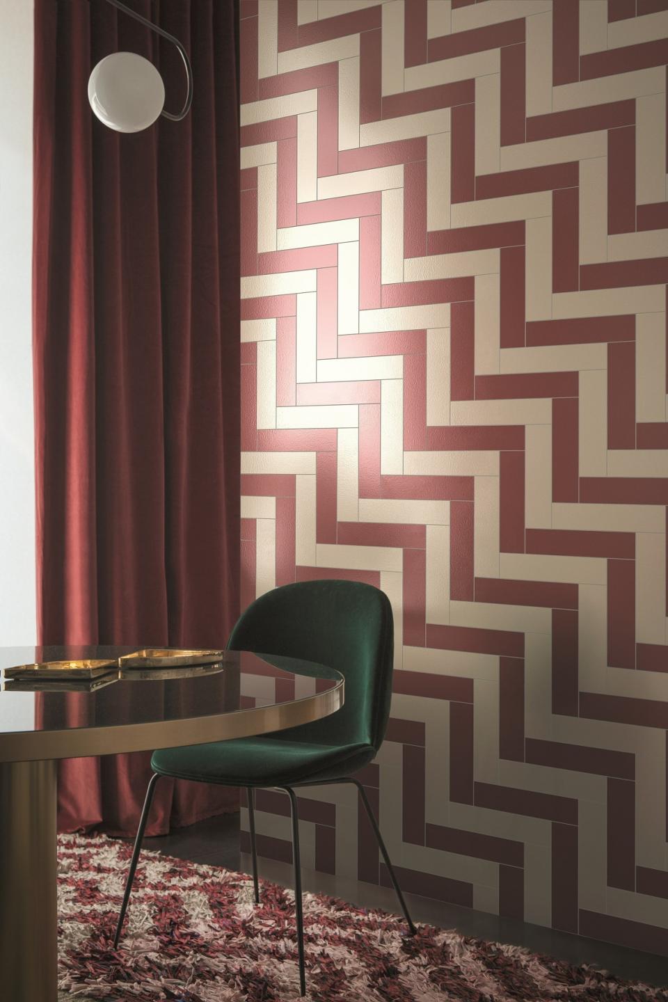 Colorful glazed porcelain tiles from the Pittorica collection by Studiopepe, enhancing a stylish interior space.