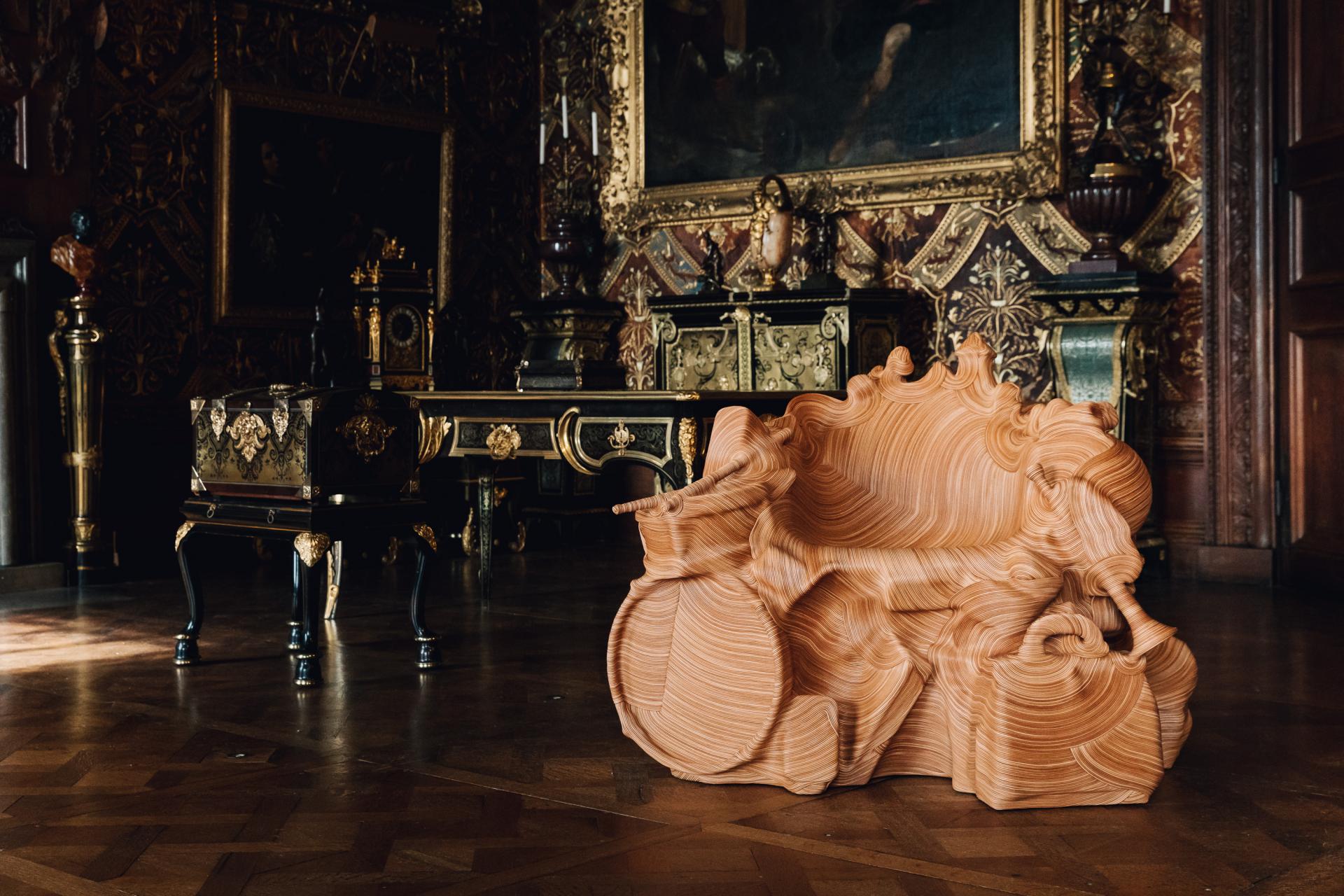 Contemporary sculptural sofa in Chatsworth House, showcasing rich heritage and innovative design within opulent decor.