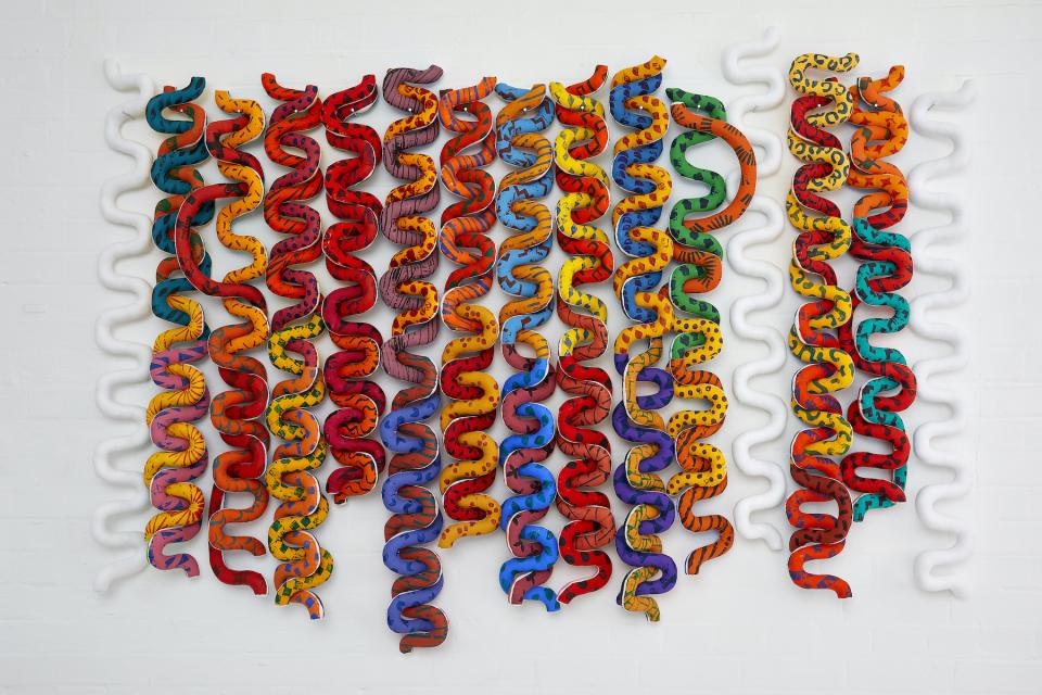 Colorful, abstract wall installation with wavy forms, showcasing contemporary art at House on Mars during Collect 2021.