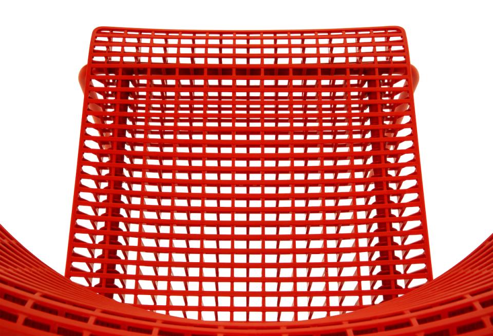 Red CALA chair by Martin Ballendat showcasing a modern, eco-sustainable design with a unique mesh structure.