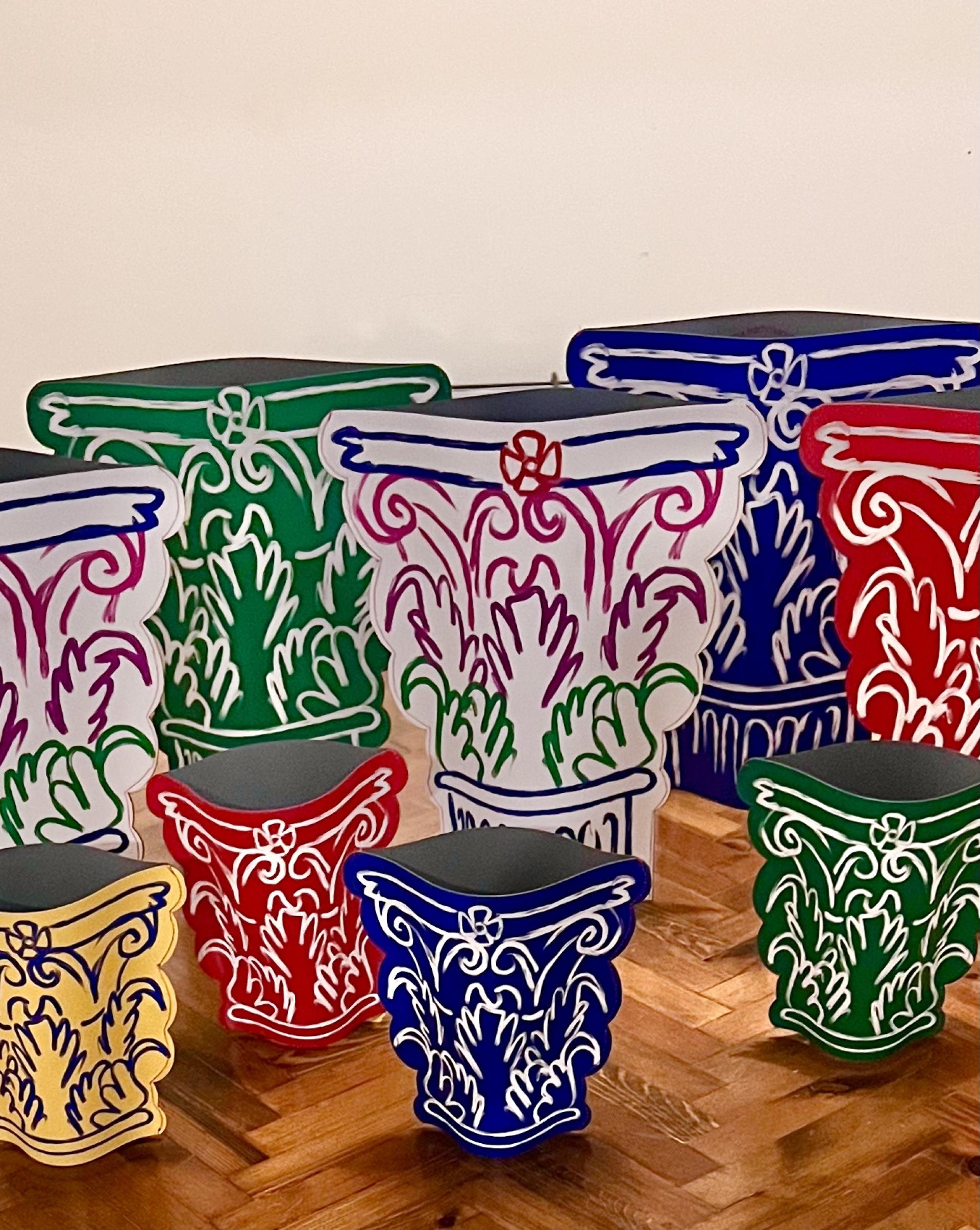 Colorful, decorative pots with intricate designs, showcasing craft artistry and creativity at the Harewood Biennial 2024.