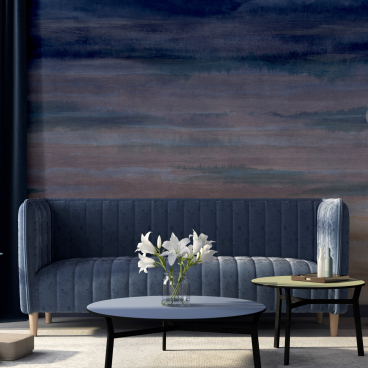 Elegant living room featuring Muraspec's Dreamscape ombre wallcovering, blue velvet sofa, and stylish decor accents.