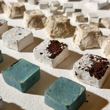 Textured squares of innovative materials displayed at New Designers 2024, showcasing contemporary design and sustainable creativity.